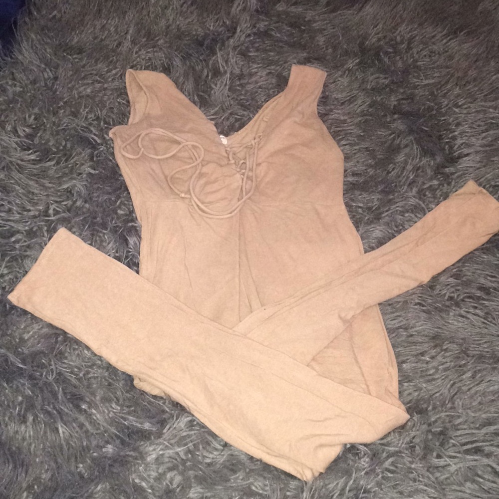 Tan jumpsuits with string up in front!